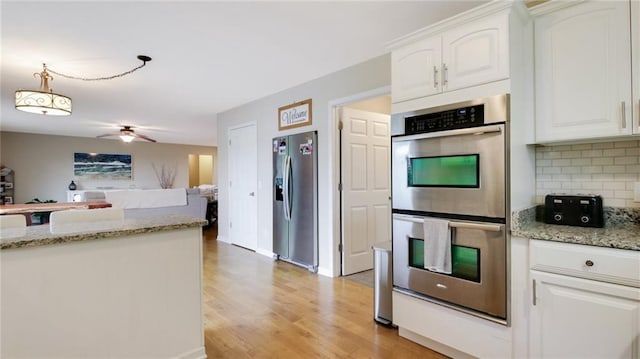 1604 Lake Rd, Altoona, WI 54720 - kitchen with stainless steel appliances, white cabinetry, light wood-style flooring, and a ceiling fan