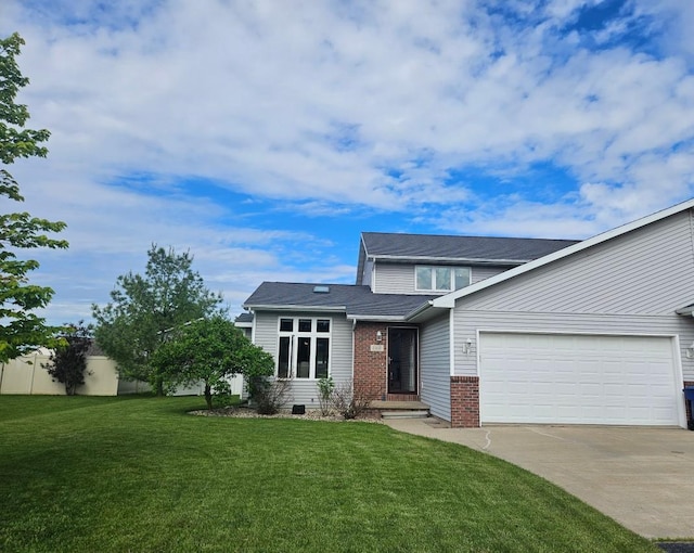 1110 Stillmeadow Ln, Menasha, WI 54952 - view of front of property featuring driveway, brick siding, and a garage