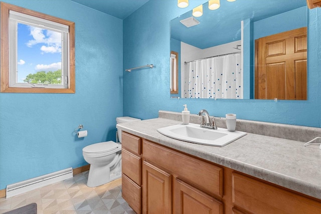 1110 Stillmeadow Ln, Menasha, WI 54952 - bathroom featuring a baseboard heating unit, vanity, tile patterned floors, toilet, and baseboards