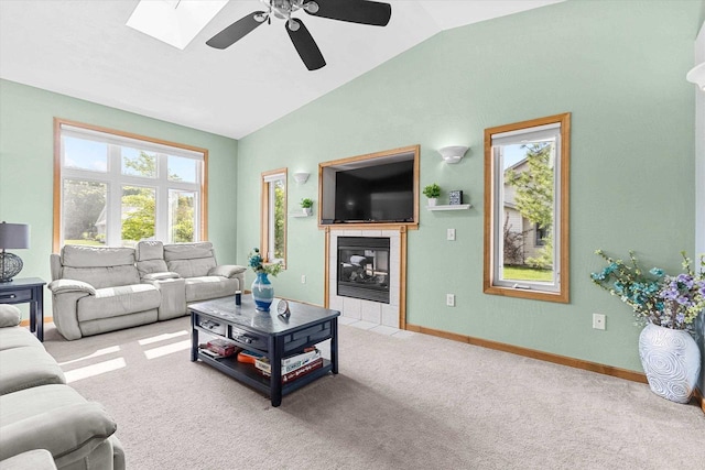1110 Stillmeadow Ln, Menasha, WI 54952 - living room with vaulted ceiling, ceiling fan, light colored carpet, baseboards, and a tile fireplace