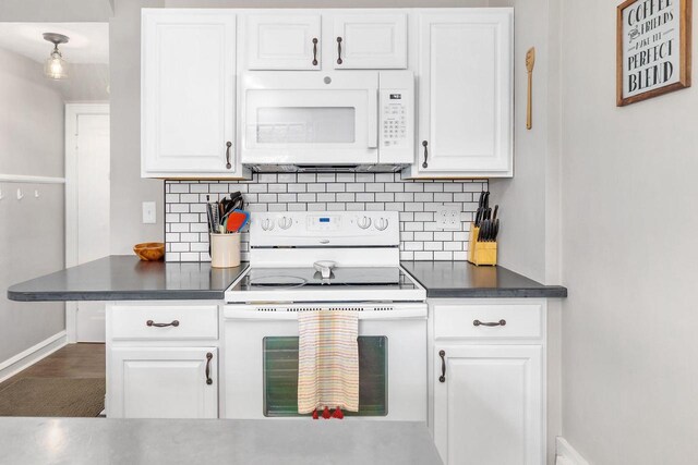 813 W Summer St, Appleton, WI 54914 - kitchen with white appliances, baseboards, backsplash, and dark countertops