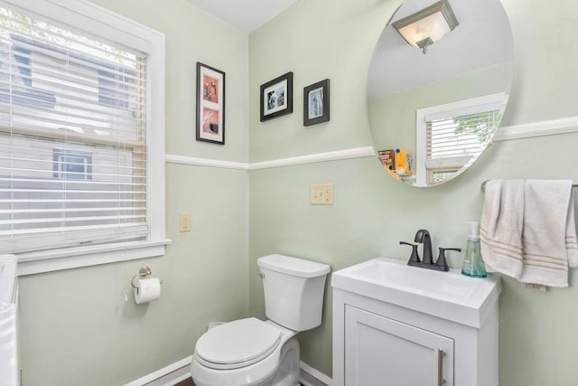 813 W Summer St, Appleton, WI 54914 - half bathroom with vanity, toilet, and baseboards