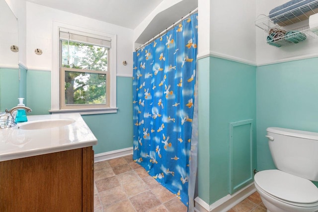 813 W Summer St, Appleton, WI 54914 - bathroom with vanity, toilet, curtained shower, and stone finish floors