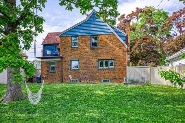813 W Summer St, Appleton, WI 54914 - rear view of house with brick siding and a balcony