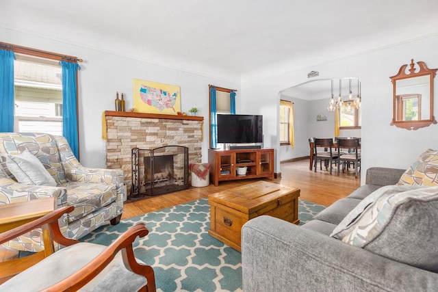 813 W Summer St, Appleton, WI 54914 - living room with plenty of natural light, wood finished floors, and a stone fireplace