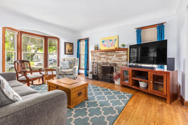 813 W Summer St, Appleton, WI 54914 - living room featuring wood finished floors and a stone fireplace