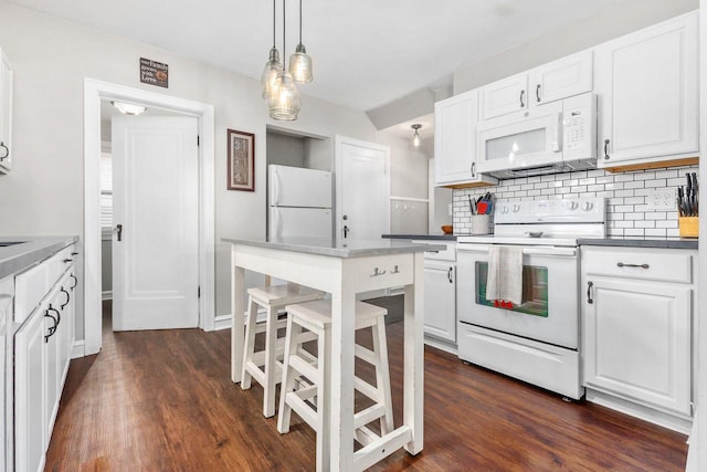 813 W Summer St, Appleton, WI 54914 - kitchen featuring white appliances, backsplash, and white cabinets