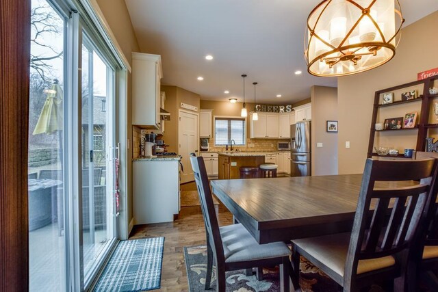 6679 S Chickahauk Trl, Middleton, WI 53562 - dining room with a chandelier, recessed lighting, and dark wood-type flooring