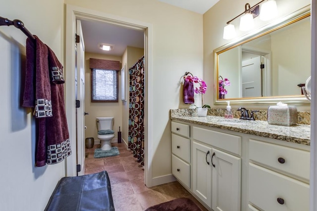 6679 S Chickahauk Trl, Middleton, WI 53562 - bathroom featuring toilet, vanity, and baseboards