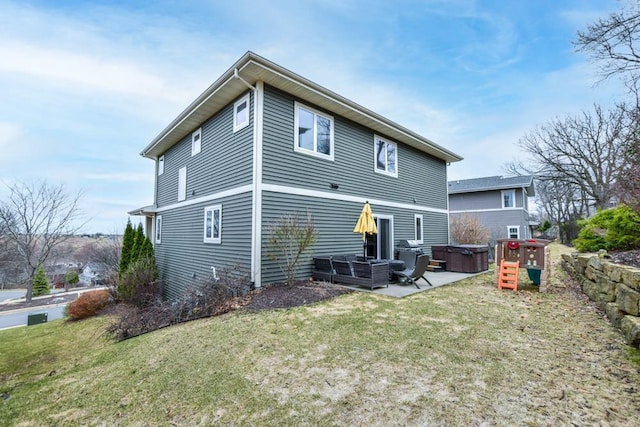 6679 S Chickahauk Trl, Middleton, WI 53562 - back of house featuring a hot tub, a patio area, a lawn, and outdoor lounge area