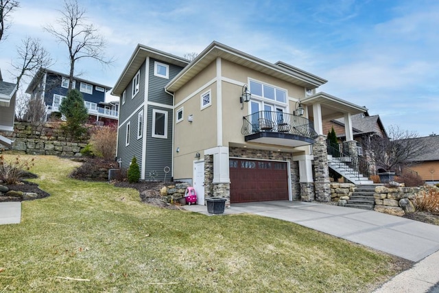 6679 S Chickahauk Trl, Middleton, WI 53562 - view of home's exterior with a garage, concrete driveway, a yard, a balcony, and stairway