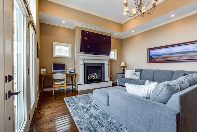 6679 S Chickahauk Trl, Middleton, WI 53562 - living room with a chandelier, dark wood-type flooring, a glass covered fireplace, ornamental molding, and recessed lighting