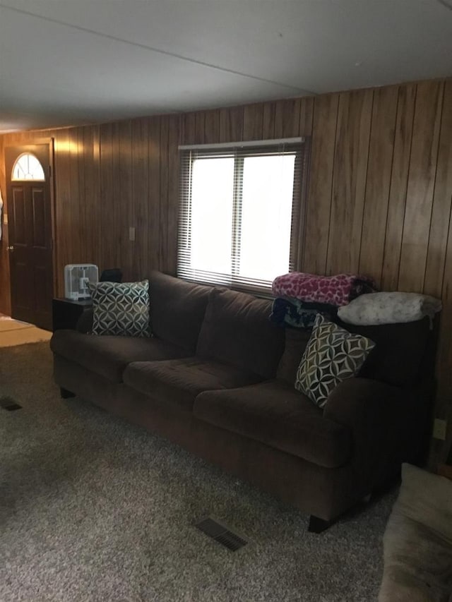 N7777 Kitty Dell Rd, Crivitz, WI 54114 - carpeted living room featuring wood walls