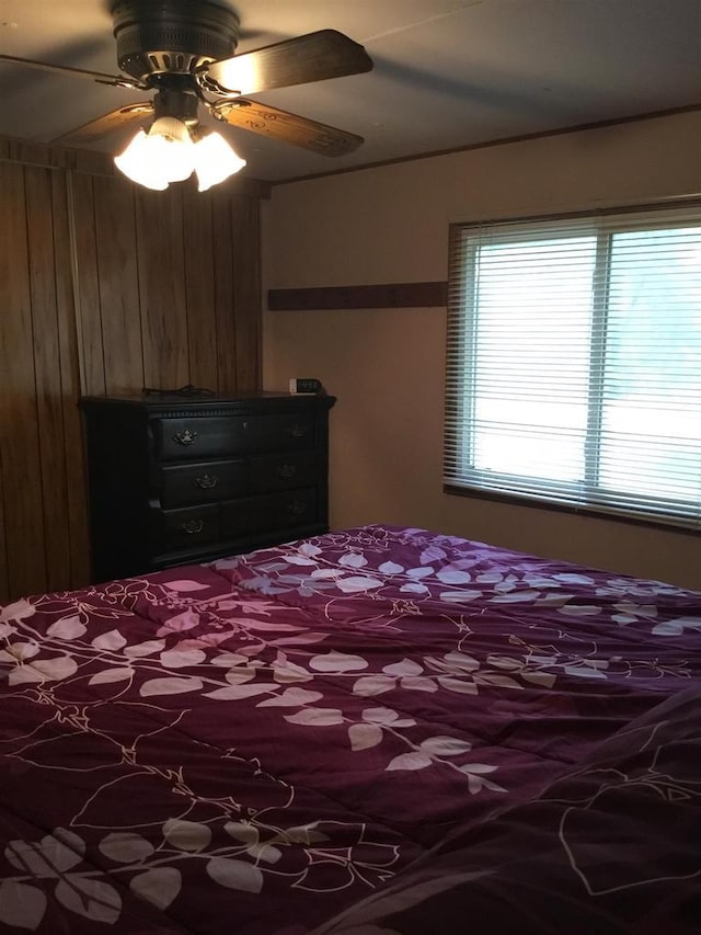 N7777 Kitty Dell Rd, Crivitz, WI 54114 - bedroom with wooden walls and a ceiling fan