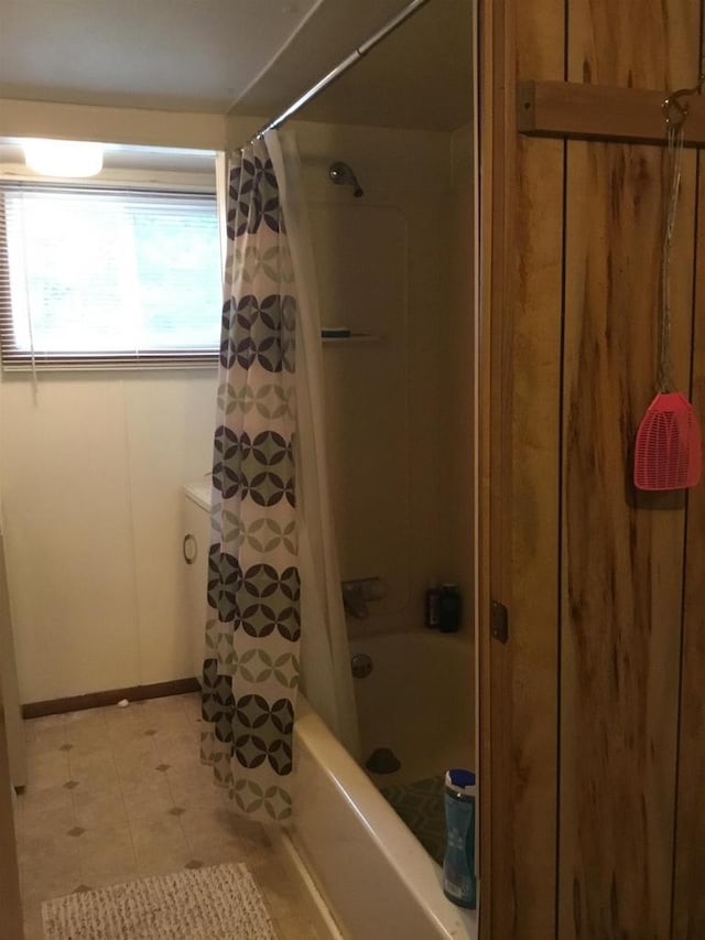 N7777 Kitty Dell Rd, Crivitz, WI 54114 - full bathroom featuring shower / bath combination with curtain, baseboards, and tile patterned flooring