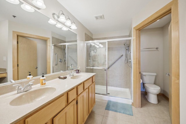 3710 N Oakland Ave Unit 304, Shorewood, WI 53211 - bathroom with toilet, double vanity, a stall shower, and tile patterned flooring