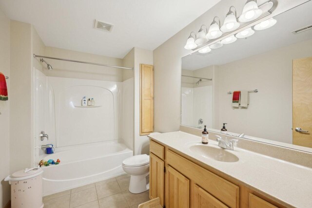 3710 N Oakland Ave Unit 304, Shorewood, WI 53211 - bathroom with toilet, vanity, washtub / shower combination, and tile patterned flooring