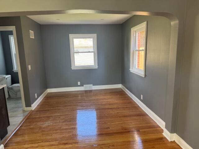2254 W Roosevelt Dr, Milwaukee, WI 53209 - spare room featuring plenty of natural light, wood finished floors, and baseboards