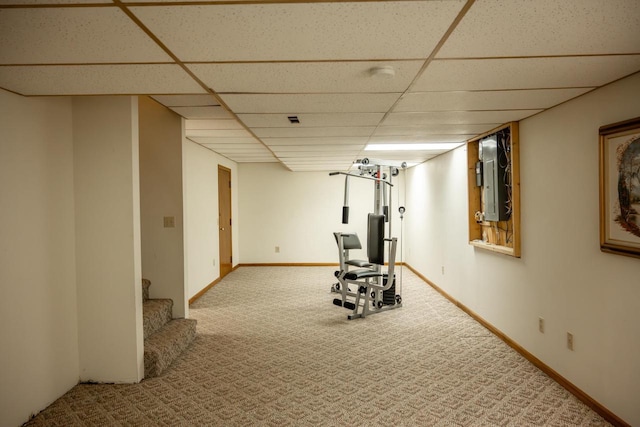 706 Tremont St, Mauston, WI 53948 - workout room with a drop ceiling, carpet flooring, and baseboards
