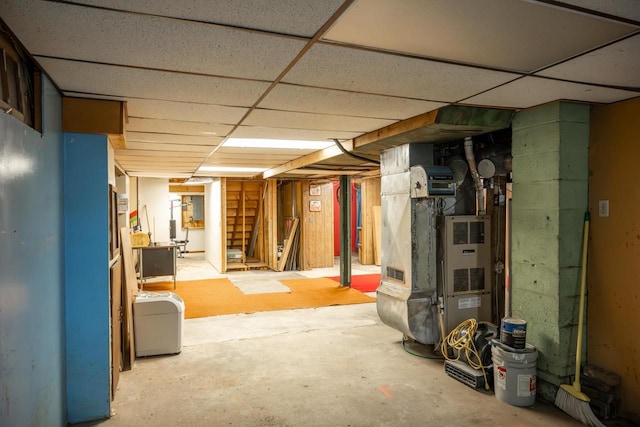 706 Tremont St, Mauston, WI 53948 - unfinished basement featuring a drop ceiling and heating unit