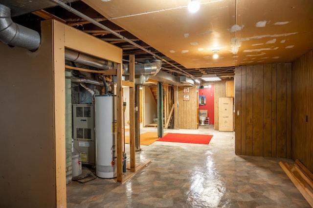 706 Tremont St, Mauston, WI 53948 - unfinished basement with gas water heater and wood walls
