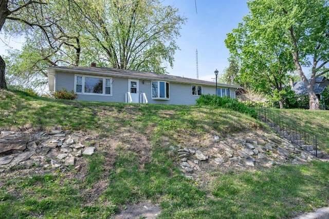 706 Tremont St, Mauston, WI 53948 - view of front of house with a chimney