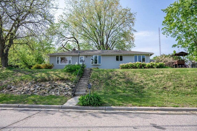 706 Tremont St, Mauston, WI 53948 - ranch-style house with stairway and a front lawn