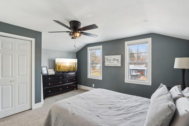 707 E Roland St, Oconomowoc, WI 53066 - carpeted bedroom with lofted ceiling, baseboards, a closet, and ceiling fan