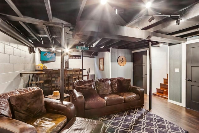 707 E Roland St, Oconomowoc, WI 53066 - living room featuring wood finished floors, stairs, and concrete block wall