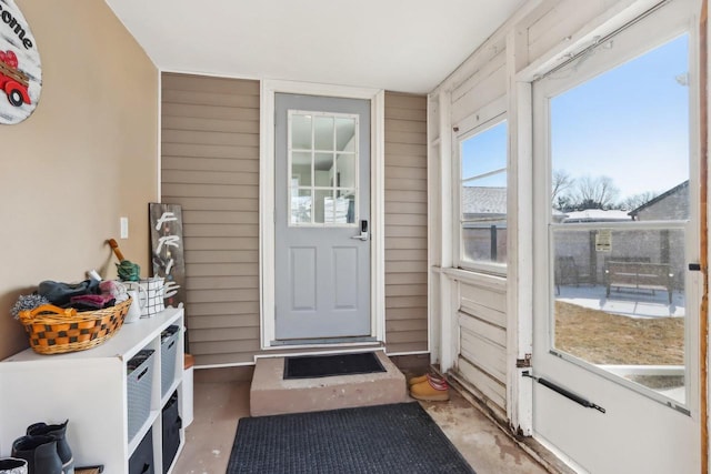 707 E Roland St, Oconomowoc, WI 53066 - doorway featuring wood walls and concrete floors