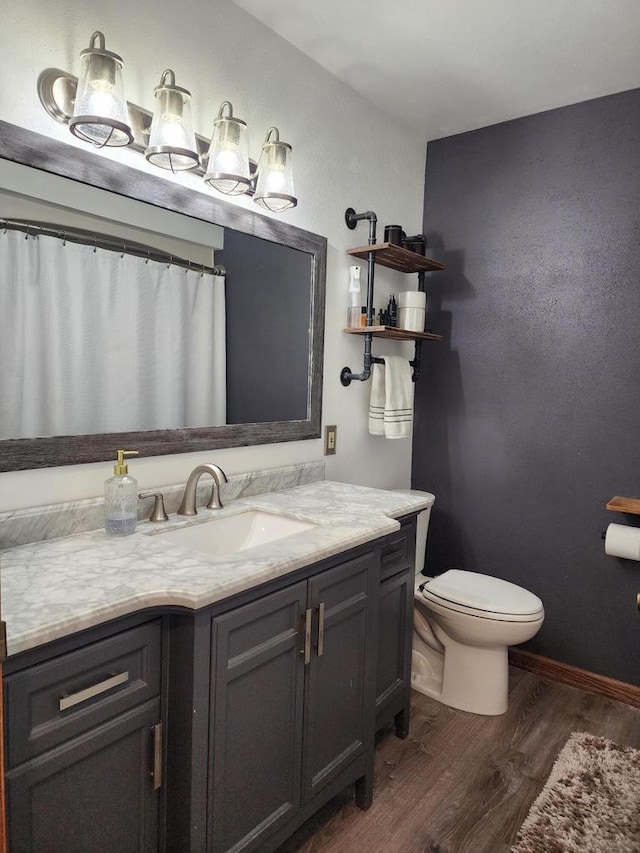 326 N 15th St, Oostburg, WI 53070 - full bathroom featuring wood finished floors, toilet, and vanity