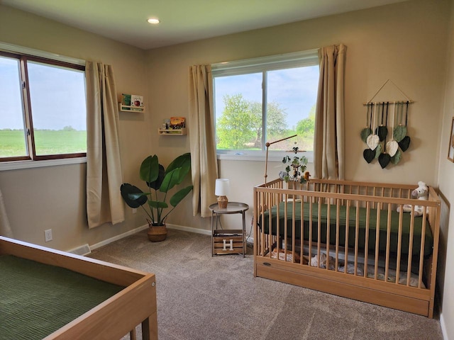 326 N 15th St, Oostburg, WI 53070 - bedroom with carpet flooring, baseboards, a crib, and recessed lighting