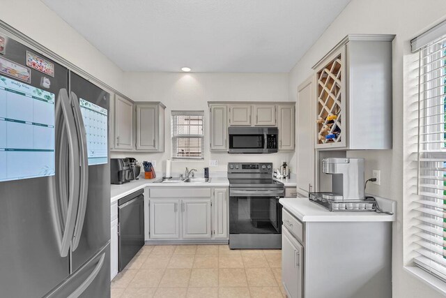 10245 66th Ave Unit 2Bb, Pleasant Prairie, WI 53158 - kitchen featuring stainless steel appliances, a sink, and plenty of natural light