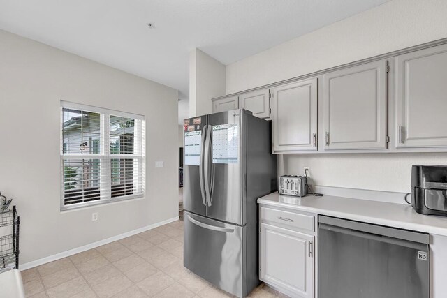 10245 66th Ave Unit 2Bb, Pleasant Prairie, WI 53158 - kitchen with stainless steel appliances, light countertops, light flooring, and baseboards