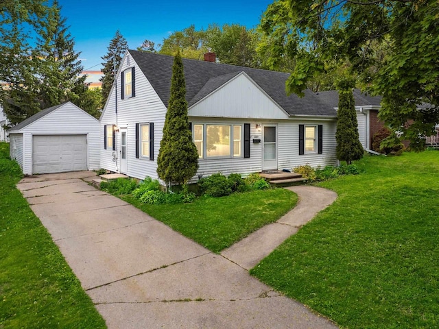 1285 Bond St, Green Bay, WI 54303 - view of front of house with an outbuilding, roof with shingles, a chimney, concrete driveway, and a front lawn