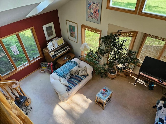 N10449 State Road 25, Wheeler, WI 54772 - living room with plenty of natural light, carpet, and high vaulted ceiling