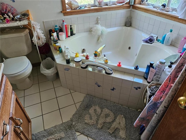 N10449 State Road 25, Wheeler, WI 54772 - bathroom with tile patterned flooring, toilet, and a whirlpool tub