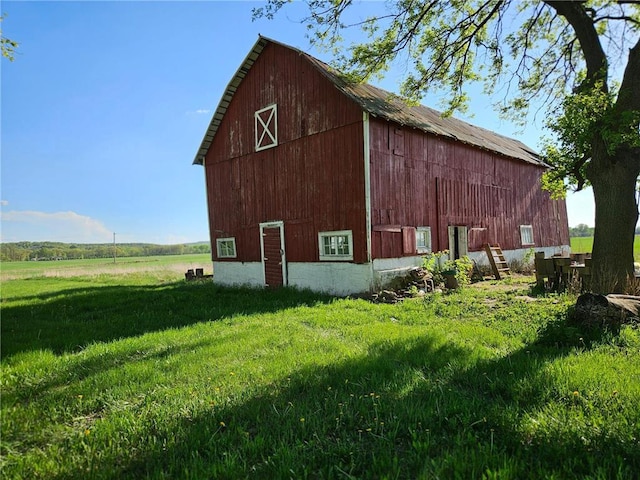 N10449 State Road 25, Wheeler, WI 54772 - view of barn featuring a yard
