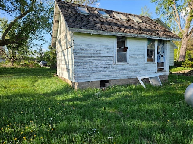 N10449 State Road 25, Wheeler, WI 54772 - view of property exterior featuring a yard and an outbuilding