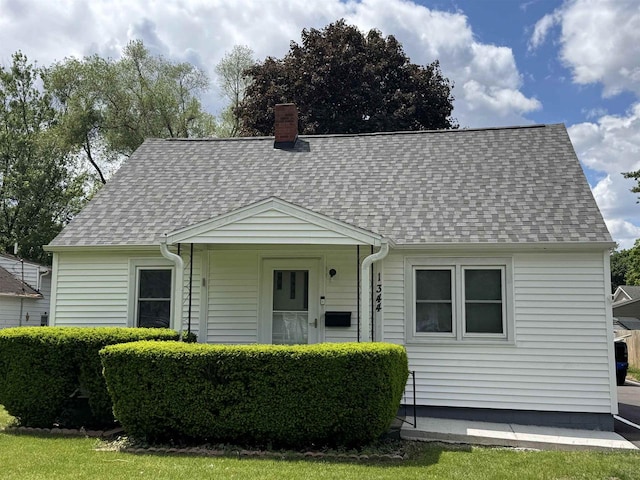 1344 Mckinley Ave, Beloit, WI 53511 - new england style home featuring a shingled roof and a chimney