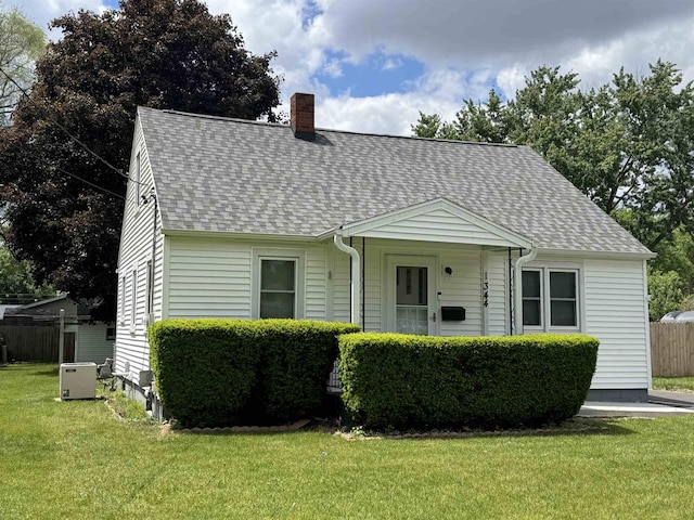 1344 Mckinley Ave, Beloit, WI 53511 - view of front of home with roof with shingles and a chimney