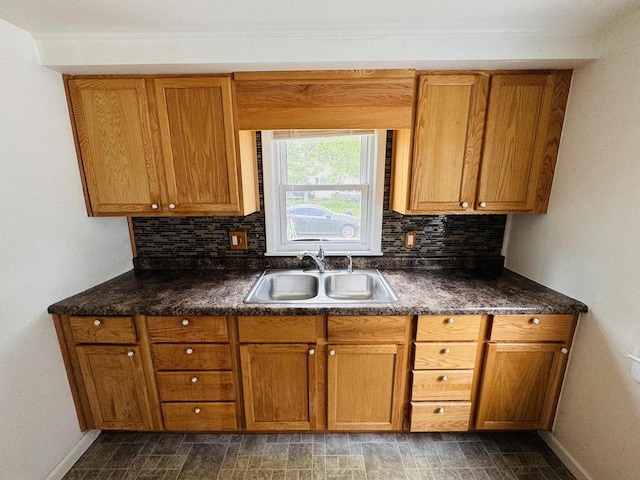 1344 Mckinley Ave, Beloit, WI 53511 - kitchen featuring a sink, tasteful backsplash, and baseboards