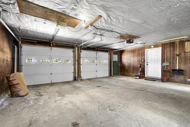 3531 N Richmond St, Appleton, WI 54911 - garage featuring a garage door opener and wood walls
