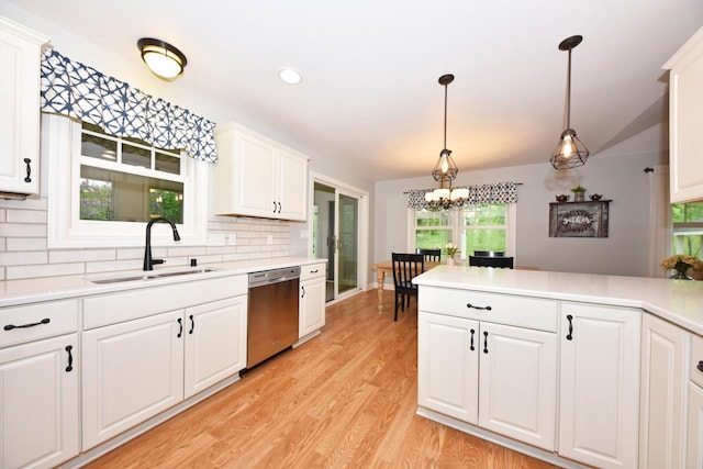 504 Sand Dr, West Bend, WI 53095 - kitchen featuring dishwasher, a sink, decorative backsplash, light countertops, and recessed lighting