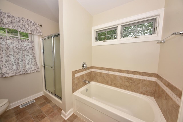 504 Sand Dr, West Bend, WI 53095 - full bath featuring a bath, plenty of natural light, toilet, and a shower stall
