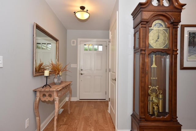 504 Sand Dr, West Bend, WI 53095 - foyer entrance with light wood-type flooring and baseboards