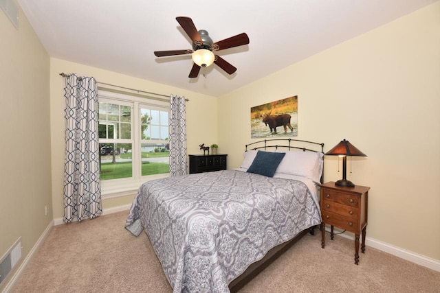 504 Sand Dr, West Bend, WI 53095 - carpeted bedroom with baseboards and a ceiling fan