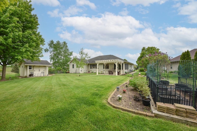 504 Sand Dr, West Bend, WI 53095 - view of green lawn with a pergola and an outdoor structure