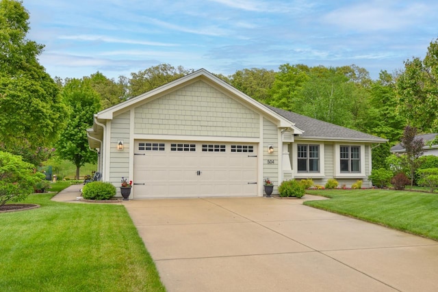 504 Sand Dr, West Bend, WI 53095 - ranch-style home with driveway, a garage, and a front yard