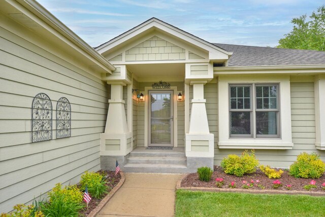 504 Sand Dr, West Bend, WI 53095 - doorway to property with roof with shingles
